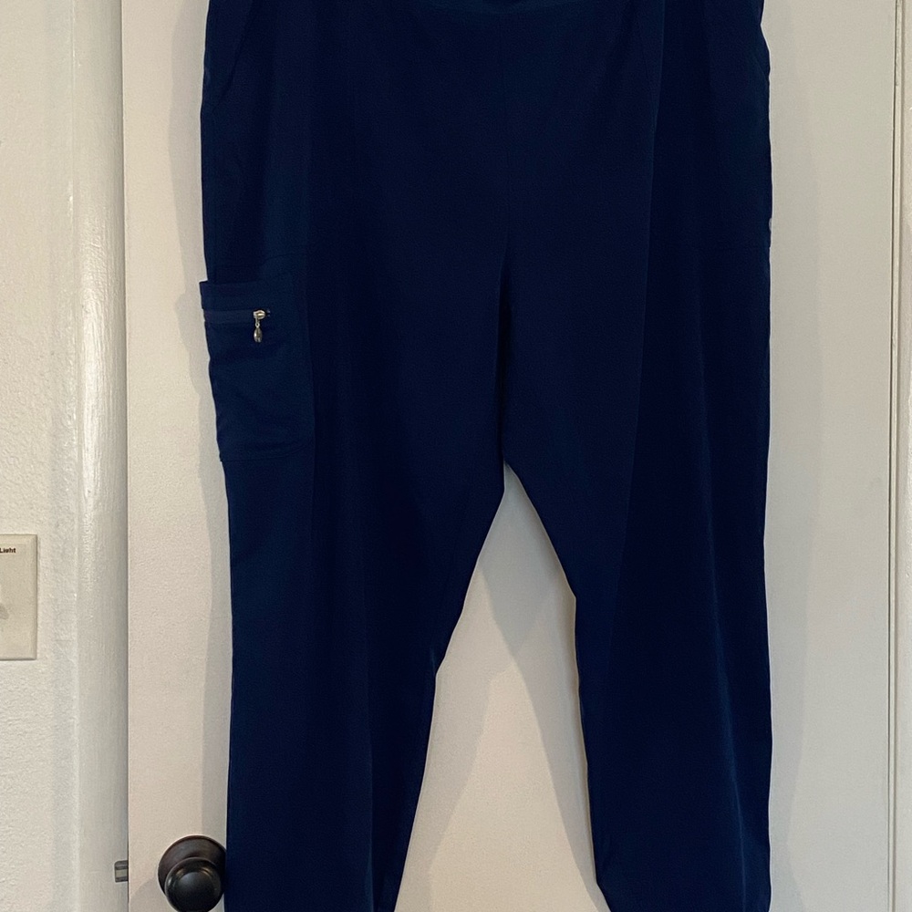 Navy Blue scrubs pant and matching zippered jacket. Pant size 2XL, Jacket XL.